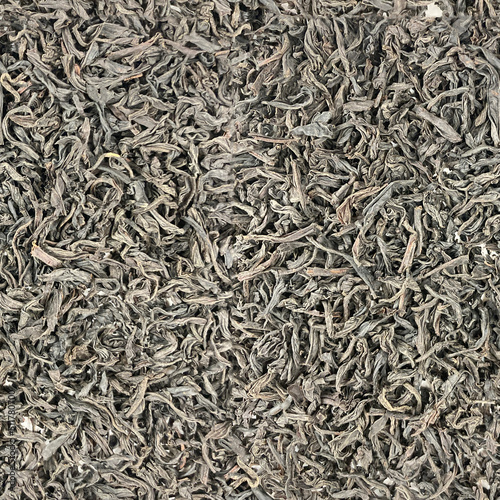 Black tea leaves spread on white background seamless pattern