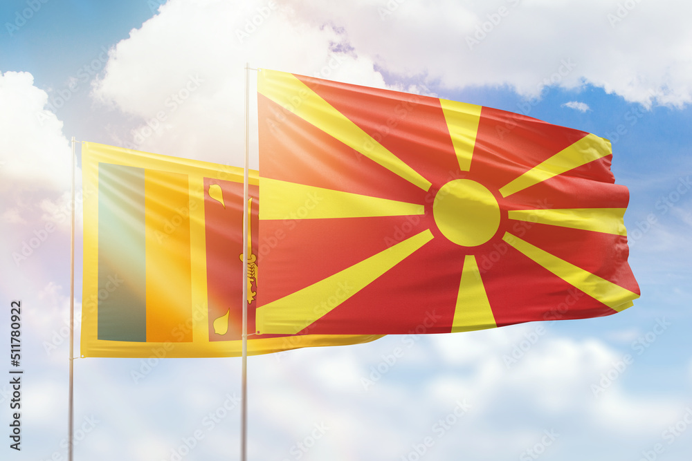 Sunny blue sky and flags of north macedonia and sri lanka