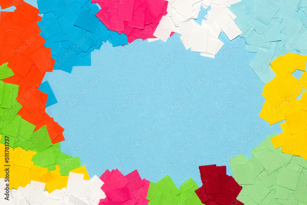pastel blue background as copy space surrounded by colorful papers, creative summer design pastel blue background as copy space surrounded by colorful papers, creative summer design