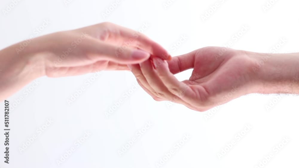 a woman and a man tightly hold each other's hands and let go on a white background. couple, love