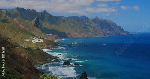 Northern Coast of Tenerife, Canary Islands. Small village Almaciga. Spectacular view on rocky coast and village, Almaciga beach in Tenerife, The Canaries. Spain. Spring. Green landscape. Sunny day. photo