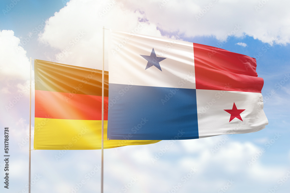 Sunny blue sky and flags of panama and germany Sunny blue sky and flags of panama and germany