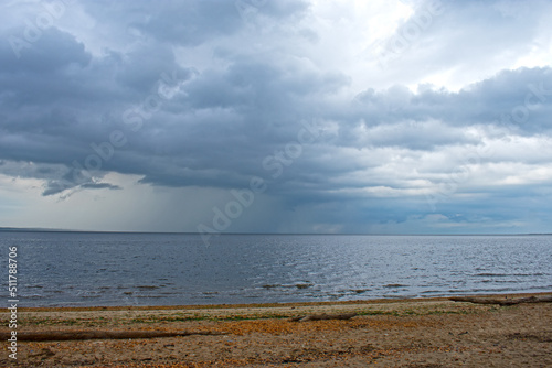 Dramatic sky over Raritan Bay at Cliffwood Beach with distant cumulonimbus clouds dropping some precipitation -07