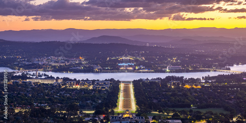 Canberra Australia viewed from Mount Ainslie at sunset looking down on the Australian War Memorial and ANZAC Parade towards Lake Burley Griffin with Parliament House behind and the suburbs of Canberra photo