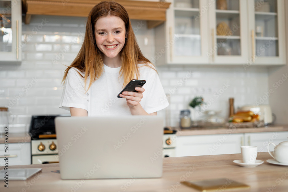 A woman uses a laptop at home for online training, education remotely on the school's website A woman uses a laptop at home for online training, education remotely on the school's website