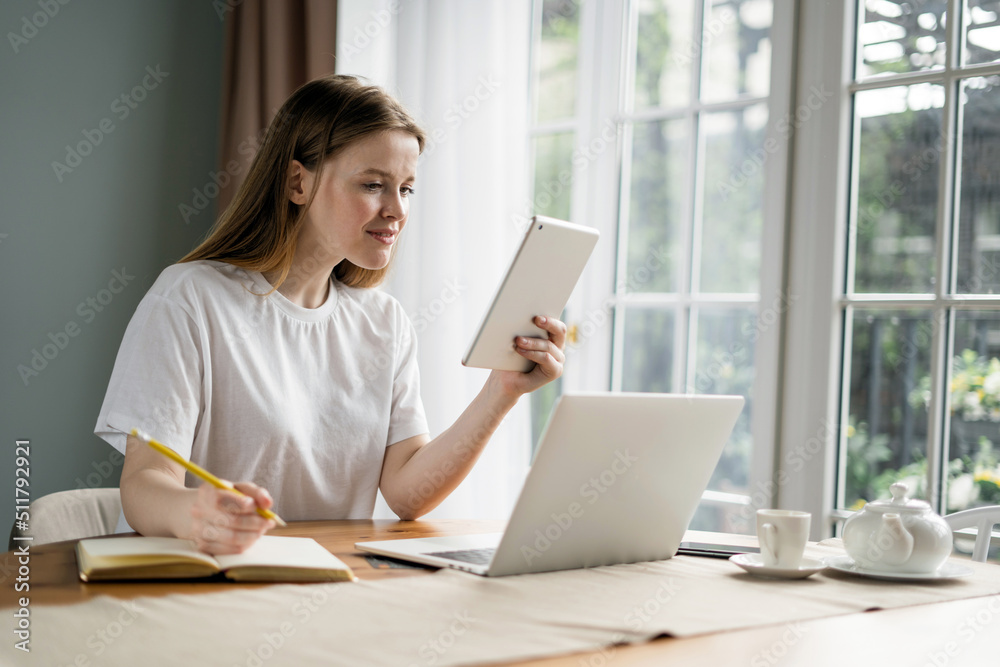 Woman uses laptop at home online training, education remotely Woman uses laptop at home online training, education remotely