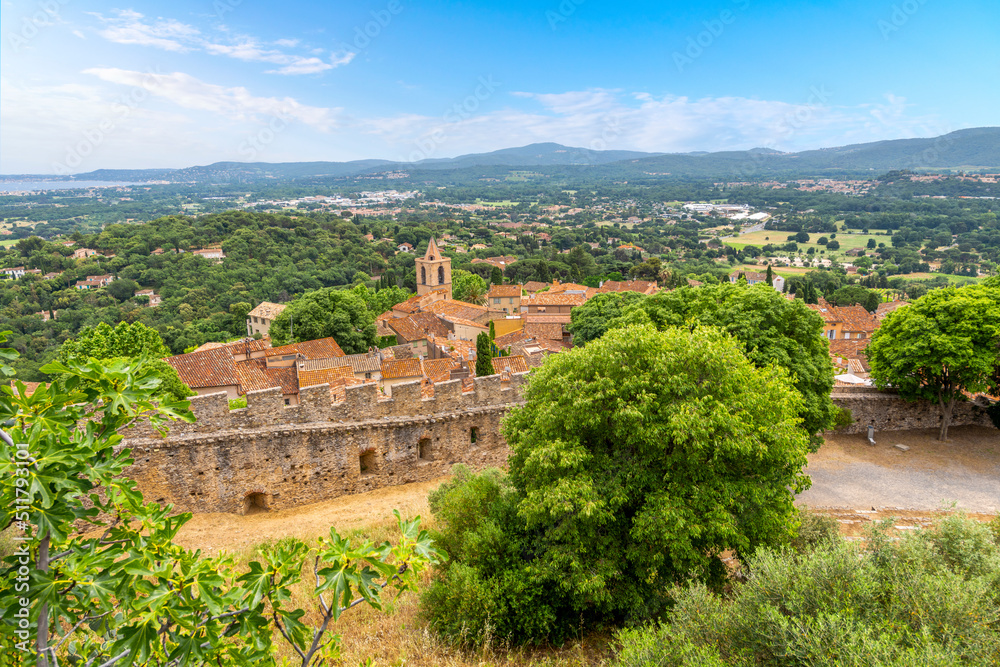 View of the medieval village of Grimaud France from the Chateau de Grimaud with the countryside of the Provence region of France and the Mediterranean Sea in view above Saint-Tropez, France.