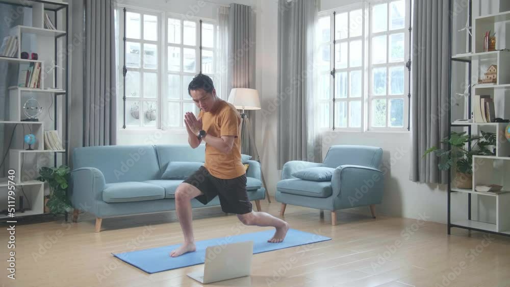 Asian Man On Mat With A Laptop Doing Yoga In High Lunge Pose At Home
Asian Man On Mat With A Laptop Doing Yoga In High Lunge Pose At Home