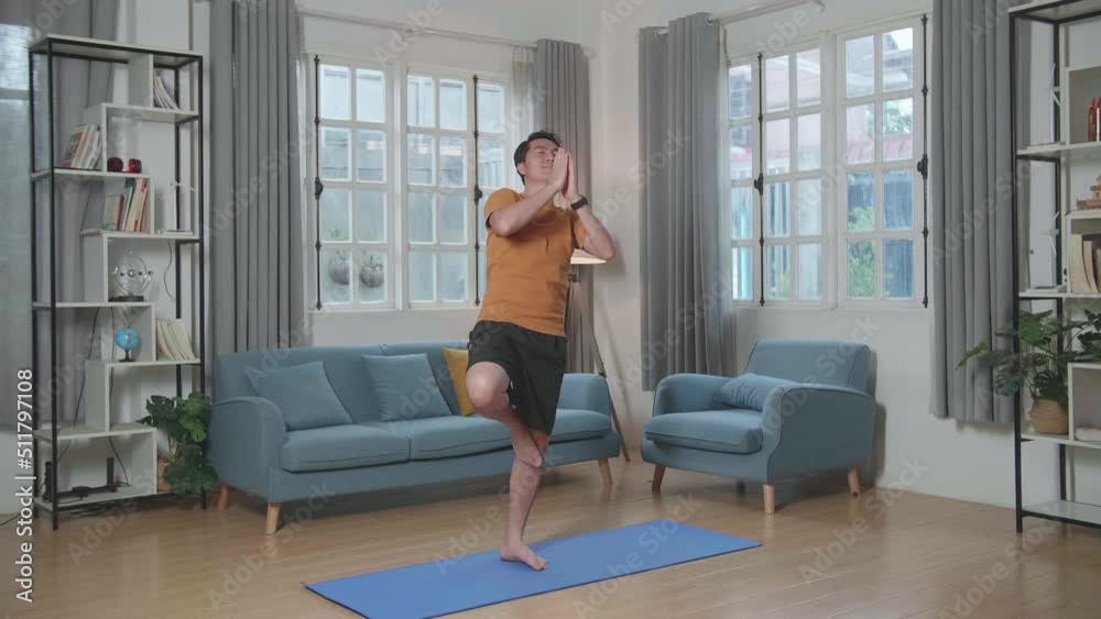 Asian Man Can'T Do Yoga In Tree Pose On Mat At Home
Asian Man Can'T Do Yoga In Tree Pose On Mat At Home