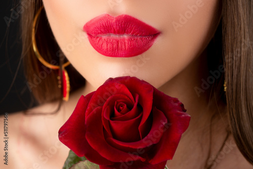 Lips with lipstick closeup. Beautiful woman lips with rose. Lipstick cosmetics makeup  fashion and beauty.