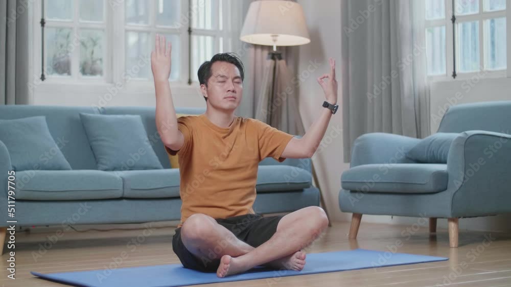 Asian Man Doing Yoga In Easy Pose On Mat At Home
Asian Man Doing Yoga In Easy Pose On Mat At Home