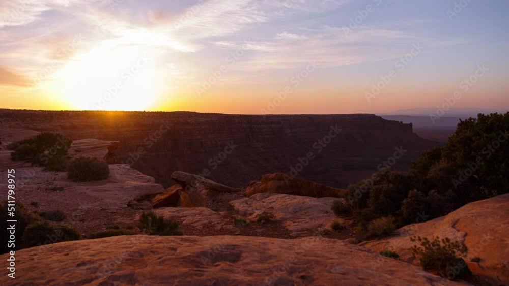 Time lapse of sunrise over sandstone cliffs and canyons in Southern Utah, USA Time lapse of sunrise over sandstone cliffs and canyons in Southern Utah, USA