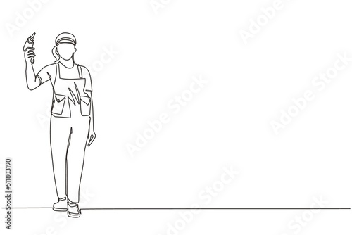 Single one line drawing woman worker holding electric drill tool for repair. Builder in uniform. Handywoman in overalls. Repairwoman with instrument. Modern continuous line draw design graphic vector
