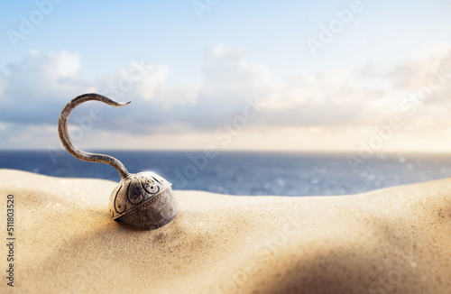 3D rendering / illustration of a pirate's hook on the sand photo