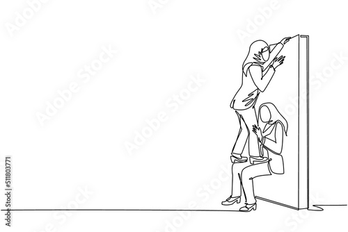 Single continuous line drawing Arabian businesswoman helping to lift another businesswoman over brick wall. Help, assistance and team concept. Business metaphor. One line draw graphic design vector