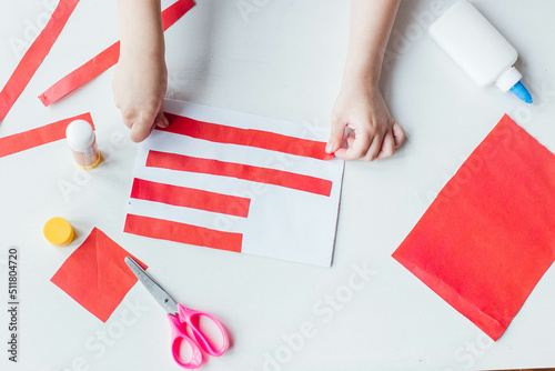 Step-by-step instruction. Child makes a postcard to the 4th of July. Patriotic holiday. Process kid children craft.USA Independence Day. Diy 4th of July decor color American flag. Flat lay top view © Наталья Мокрецова
