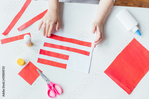 Step-by-step instruction. Child makes a postcard to the 4th of July. Patriotic holiday. Process kid children craft.USA Independence Day. Diy 4th of July decor color American flag. Flat lay top view © Наталья Мокрецова