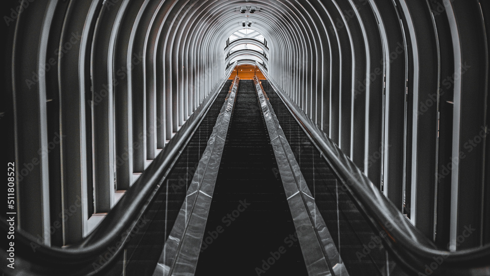 Fototapeta premium Escalator made of glass and geometric metal