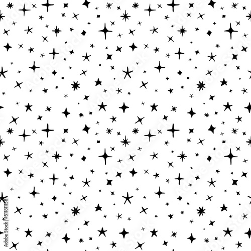 Seamless pattern of hand drawn stars of different sizes and shapes  black and white