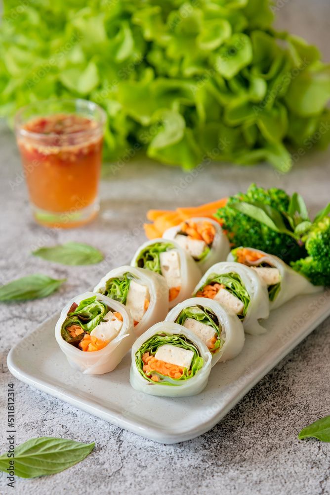 Fresh spring rolls stuff with minced pork, sausage and vegetable with spicy sauce, as local Asain food Fresh spring rolls stuff with minced pork, sausage and vegetable with spicy sauce, as local Asain food