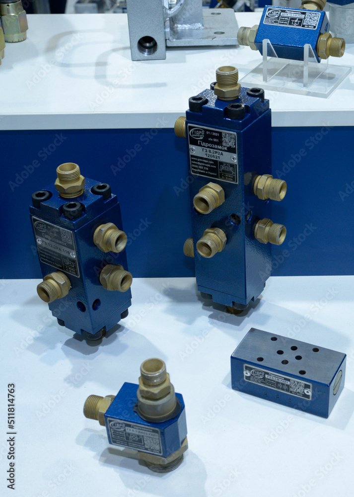 Modern hydraulic locks and safety valves presented on stand, made in