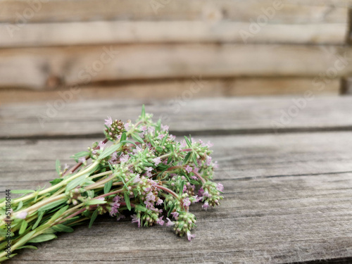 bouquet of thyme on a wooden background