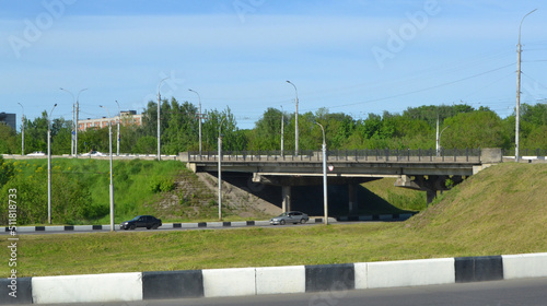 Wallpaper Mural Concrete structure of a bridge and asphalt road space under the overpass, view of the traffic junction and the intersection of the highway on the road. Torontodigital.ca