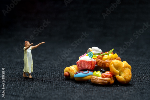 Miniature people Female sleepwalker in pajama dream about snack at night , Unhealthy concept