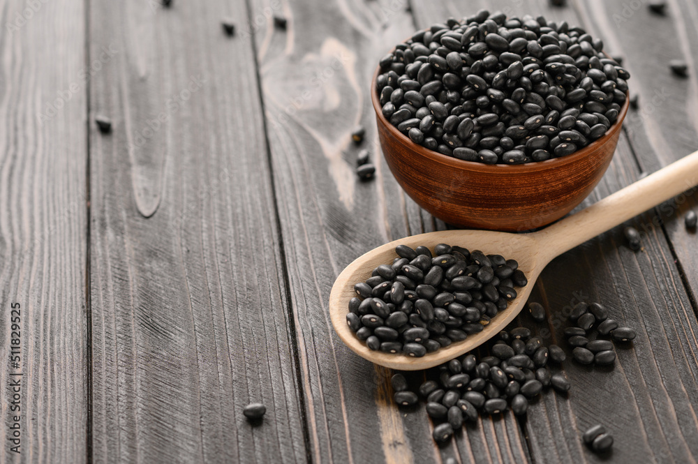 Fresh organic natural beans on wooden rustic black background Fresh organic natural beans on wooden rustic black background