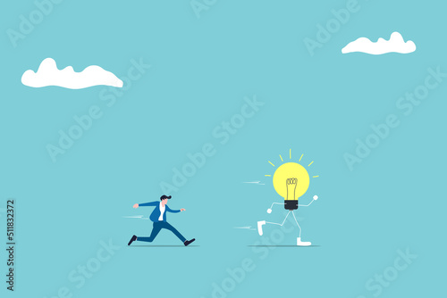 businessman chasing and catch lightbulb ideas. innovation and creativity concept.