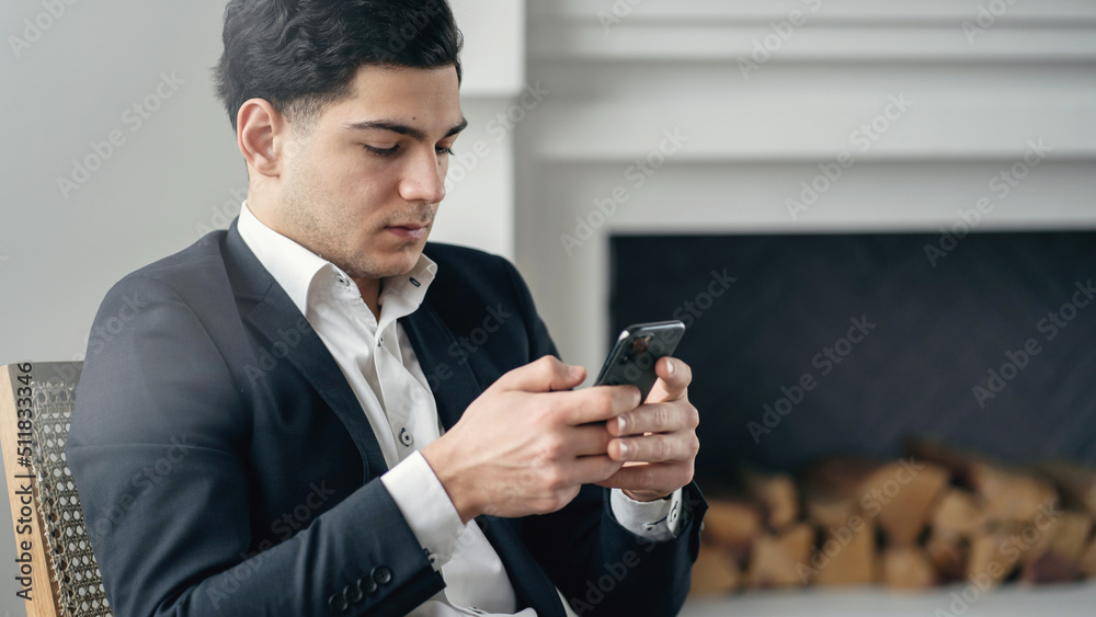 The manager uses the phone works online in the office buys shares on the stock exchange