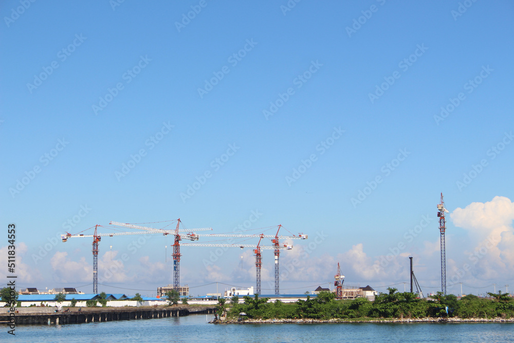 crane by the sea with blue sky crane by the sea with blue sky