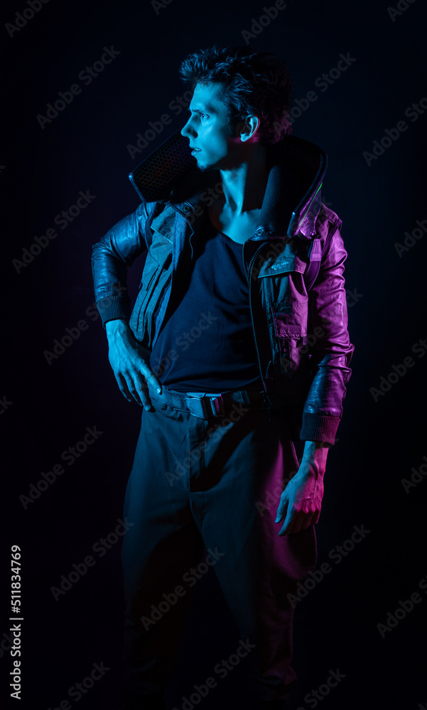 A guy in a cyberpunk image, A young man in neon lighting on a black background