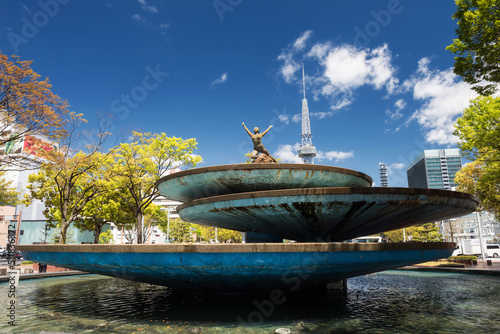 Nake woman statue on fountain of TV tower at Odori park, Nagoya photo