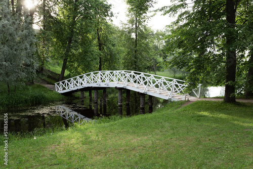 white bridge across the river in the village