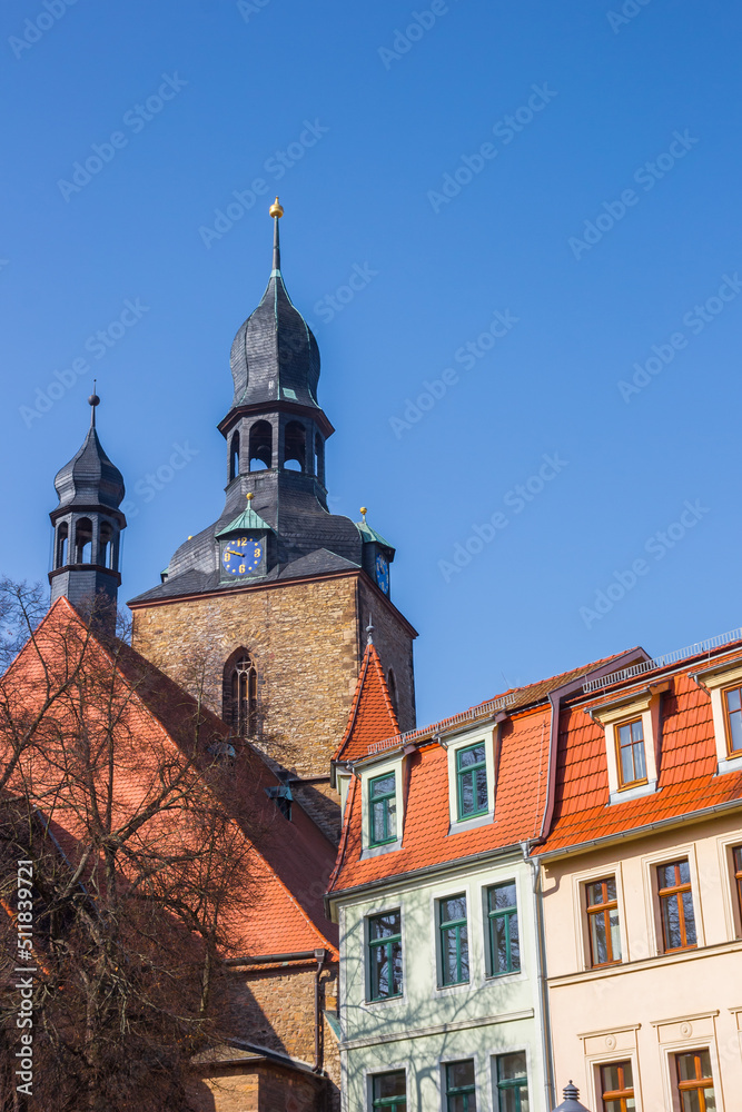 Houses in front of the historic St. Jacobi church in Hettstedt, Germany