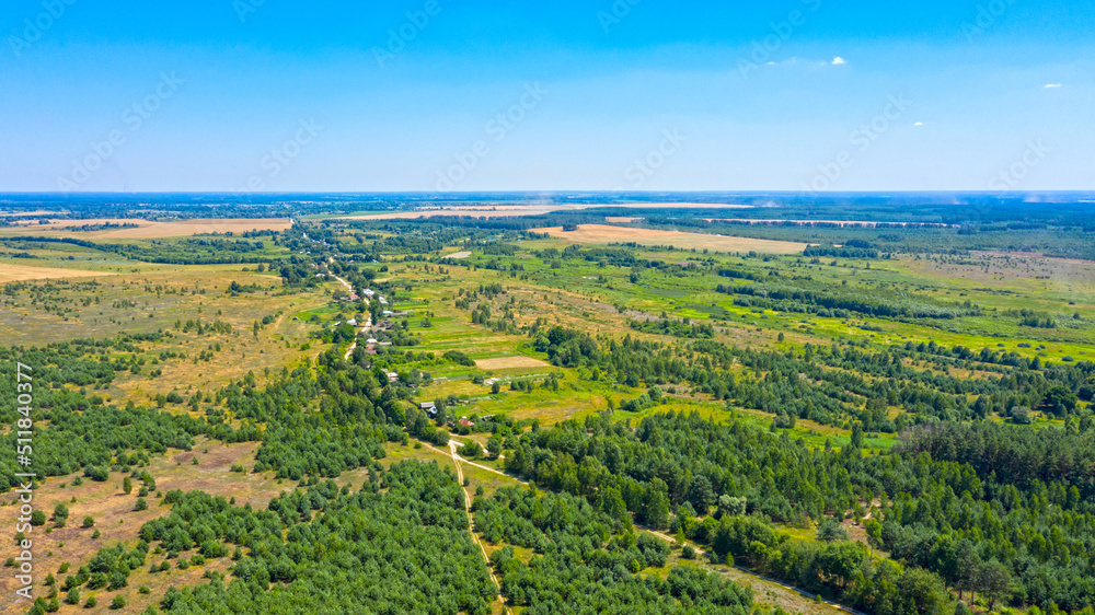 Beautiful summer landscape of a green valley. Aerial drone view over spring plain landscape.