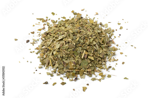 Heap of South American dried Mate tea leaves close up isolated on white background