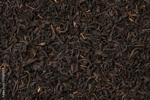Dried Chinese Lapsang souchong tea leaves close up full frame as background