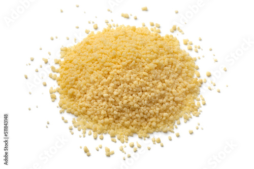 Heap of dried uncooked couscous isolated on white background