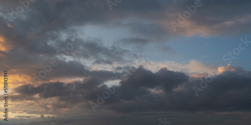 Dramatic sunset with dark stormy clouds