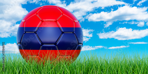 Soccer ball with Armenian flag on the green grass against blue sky  3D rendering
