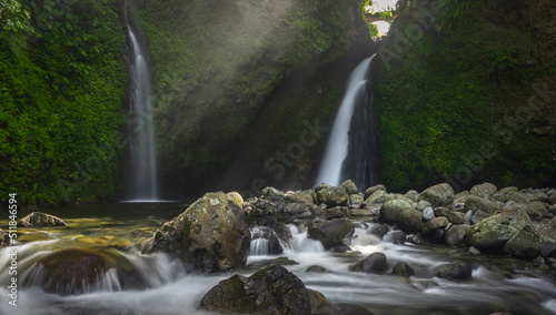 Fototapeta Naklejka Na Ścianę i Meble -  beautiful morning view with sunshine on waterfall in Indonesian tropical forest