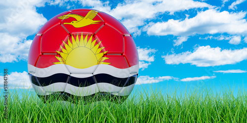 Soccer ball with Kiribatian flag on the green grass against blue sky  3D rendering