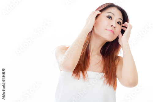 Chinese American woman wearing a white towel, beauty concept