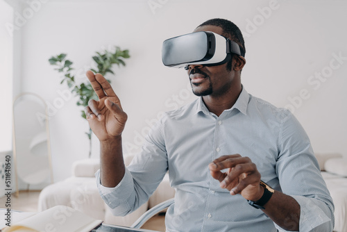 African american man developer in VR glasses use virtual reality modeling software. Future high tech