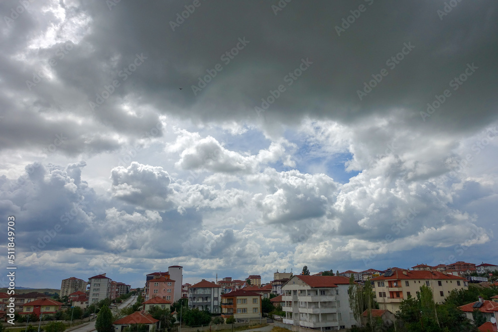 heaped white cloud cluster,city and big clouds.