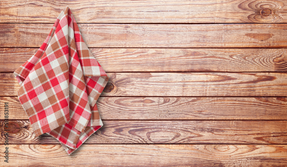 Napkin or dish towels with folds on wooden desk. Front view Napkin or dish towels with folds on wooden desk. Front view