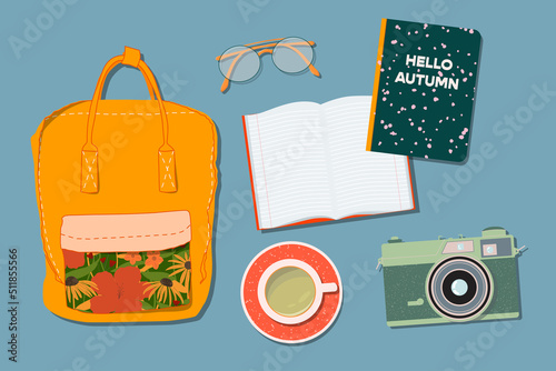 Backpack, tea cup, glasses, film camera and note book on a table. Trendy top down view illustration. Autumn atmosphere. Modern minimalistic hand drawn group of things design for web card, banner.