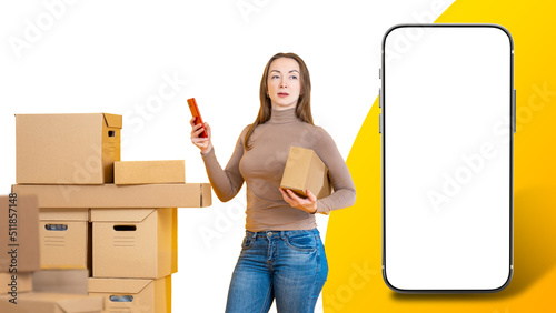 Woman in front of boxes. Mo...